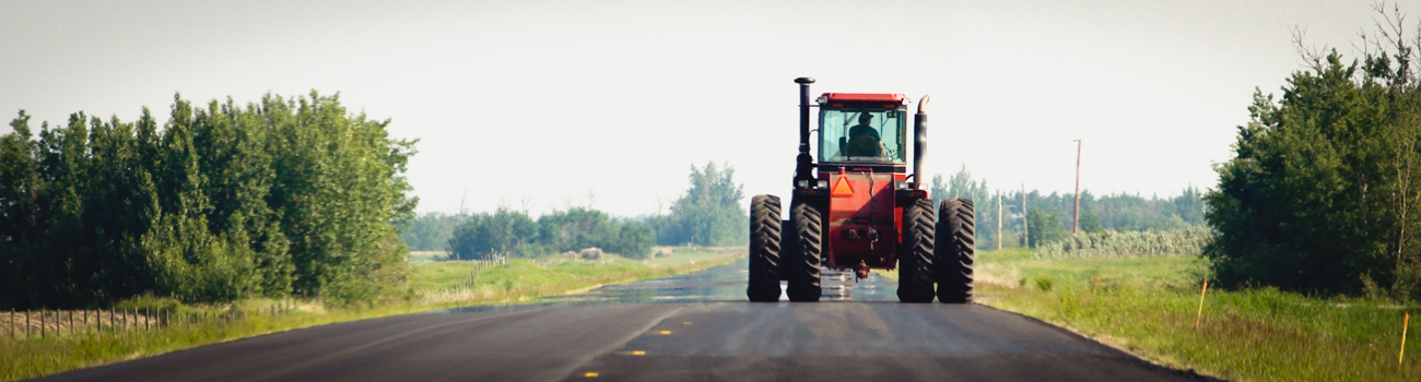 Farm equipment share the road